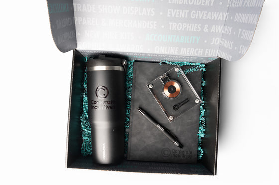 Gift set with a tumbler and notebook in a box, branded 'Corporate Incentives'.