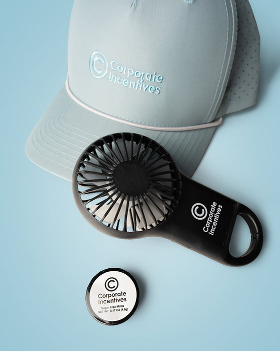 Black handheld fan with 'Corporate Incentives' branding on a light blue background